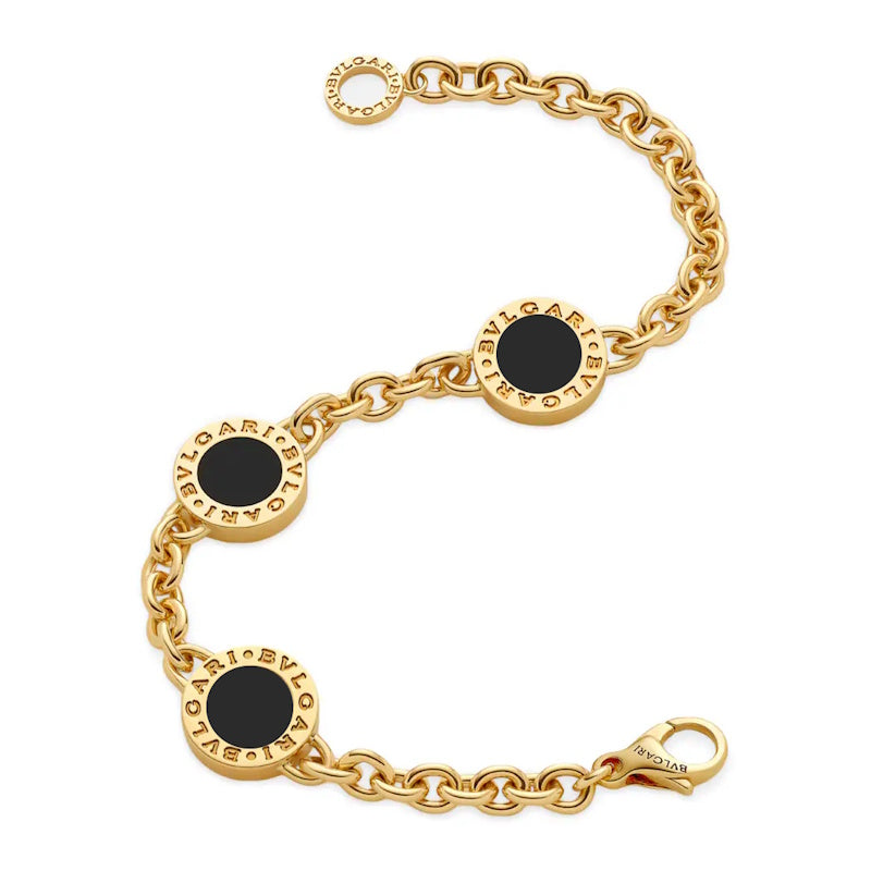 A gold chain bracelet featuring three circular gold medallions with black enamel centers, each engraved with the brand name 'MARIE VIVIETE' in reverse, on a plain white background.